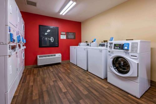 a laundry room with a washer and dryer at Extended Stay America Suites - Jacksonville - Riverwalk - Convention Center in Jacksonville