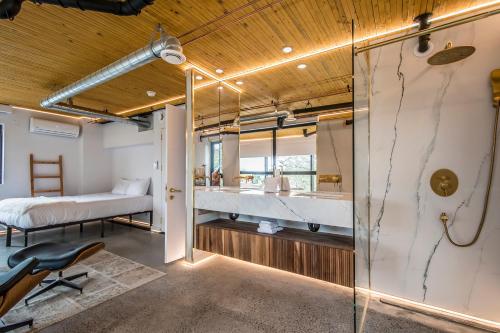 a bathroom with a shower and a bed in a room at Luxury BNB - Halifax Rooftop in Halifax
