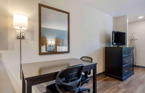a room with a desk with a mirror and a chair at Extended Stay America Suites - Fort Lauderdale - Plantation in Plantation