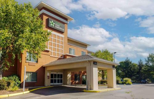a hotel with a sign on the front of a building at Extended Stay America Suites - Boston - Waltham - 52 4th Ave in Waltham