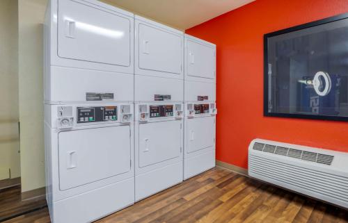 a room with white cabinets and a flat screen tv at Extended Stay America Suites - Ramsey - Upper Saddle River in Ramsey