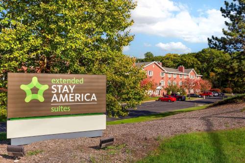 an extended stay america sign in front of a building at Extended Stay America Suites - Hartford - Farmington in Farmington