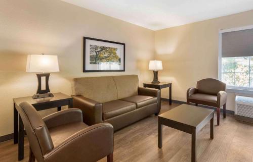 a living room with a couch and a chair at Extended Stay America Suites - Norwalk - Stamford in Norwalk