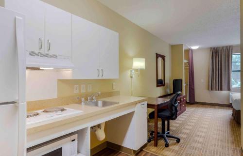 a kitchen with a sink and a desk in a room at Extended Stay America - Providence - West Warwick in West Warwick