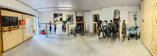a room with a bunch of bikes parked in it at Dolomitihouse AUNER in Fiera di Primiero