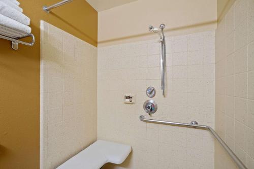 a bathroom with a shower and a toilet at Extended Stay America Suites - Washington, DC - Reston in Herndon
