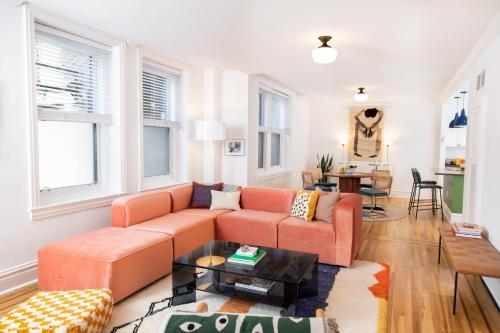 a living room with a couch and a table at The Suites at the Touraine No 109 in Philadelphia