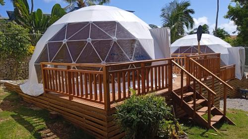 a gazebo with a yurt on a deck at Arena Oceanview Hotel & La Terraza Restaurant in Las Galeras