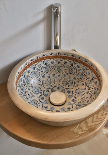 a blue and white sink with a faucet at Aqua Bliss in Xerokampos