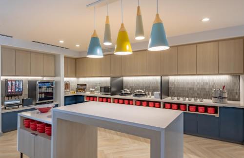 a large kitchen with a large white counter top at TownePlace Suites by Marriott Dallas Rockwall in Rockwall