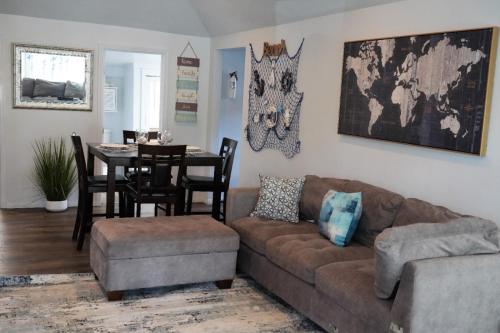 a living room with a couch and a table at Surf city House in Huntington Beach