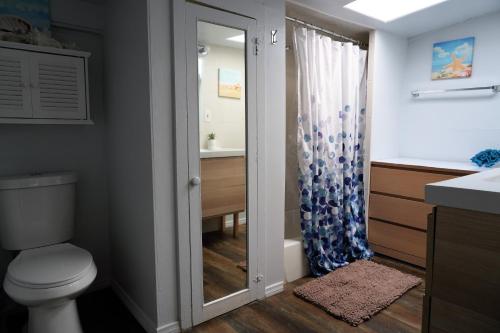 a bathroom with a toilet and a sink at Surf city House in Huntington Beach