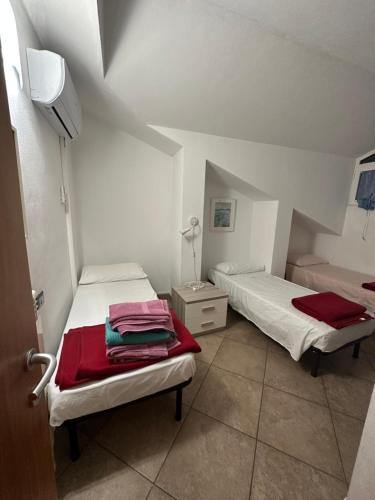 En eller flere senge i et værelse på La Quercia Fiorita