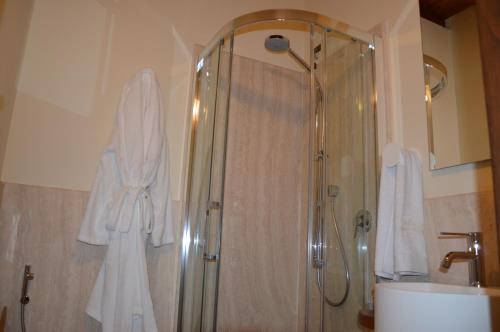 a bathroom with a shower and a sink at Fattoria Lucciano in Borghetto