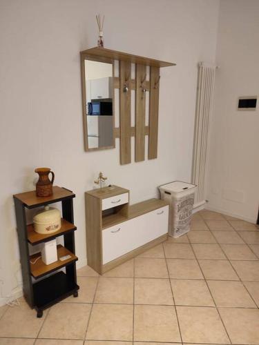 a bathroom with a sink and a mirror on the wall at Mi'Ele Apartments in Pergine Valsugana