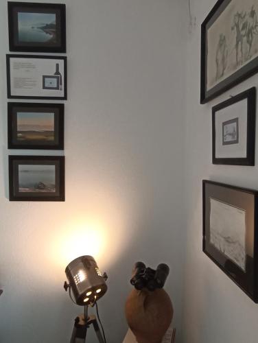 a table with a light and a camera in a room at Lux Apartment Sunset in Virpazar