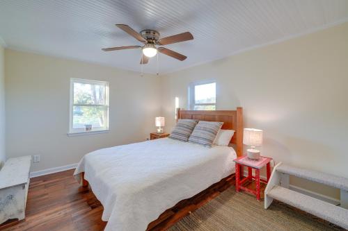 Schlafzimmer mit einem Bett und einem Deckenventilator in der Unterkunft 270-Acre Ripley Home with On-Site Pond! in Ripley