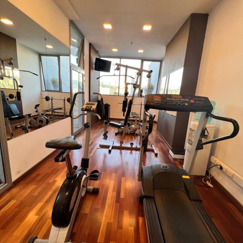a gym with several treadmills and exercise bikes at Howard Johnson by Wyndham Córdoba La Cañada in Cordoba
