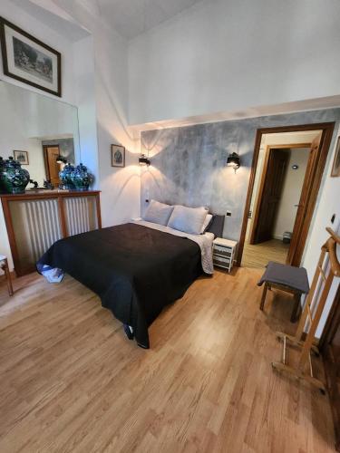 a bedroom with a large bed in a room at Hôtel La fuste in Valensole