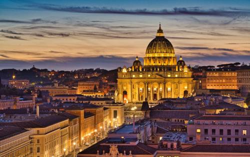 a view of a city at night at Pope's Suites in Rome