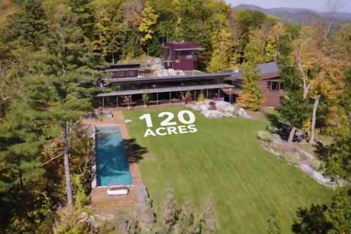 an aerial view of a house with a large yard at Magical Country Retreat in the Berkshires in Great Barrington