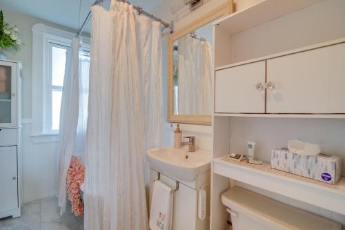 a bathroom with a sink and a shower curtain at New Bedford Apartment about 4 Mi to Fort Phoenix Beach in New Bedford