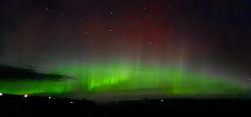 an image of the northern lights in the sky at Dunbeath Coastal Retreat in Dunbeath