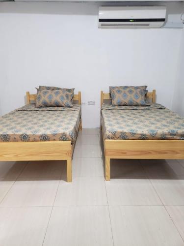 Postel nebo postele na pokoji v ubytování Mango Vert Apartment