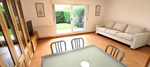 a living room with a couch and a table at Vistas Río Tormes Huerta Otea in Salamanca