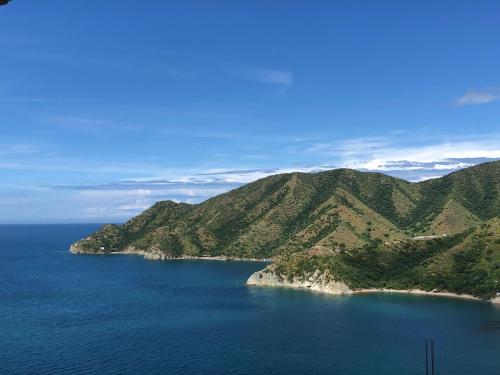 an island in the middle of a large body of water at Cabañas Annapurna in Taganga