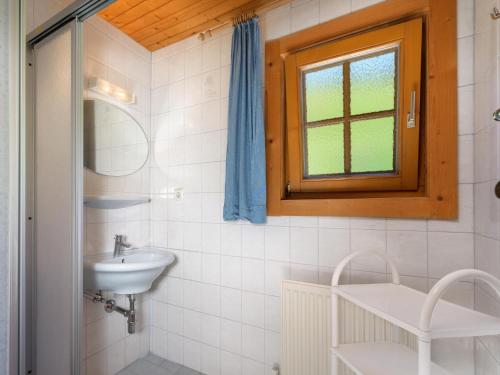 a bathroom with a sink and a window at Schüttbach in Wagrain