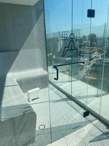 a window of a building with a view of a city at Apartamento en Bucerías frente al mar, condominio Tayau in Bucerías