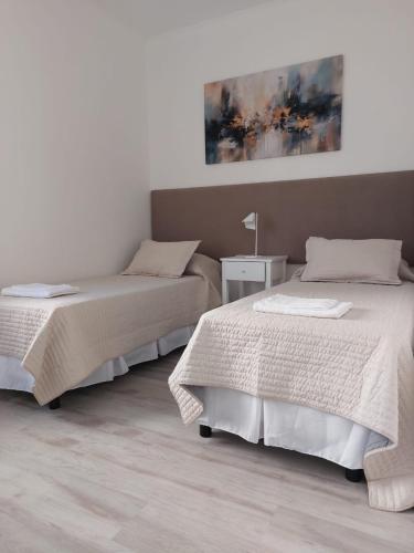 Letto o letti in una camera di Don Quijote Tandil