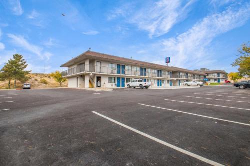 an empty parking lot in front of a building at Motel 6-Elko, NV in Elko