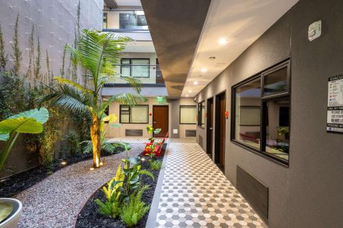 a hallway with a courtyard with plants in a building at Infinity Hotel San Francisco, Tapestry Collection by Hilton in San Francisco