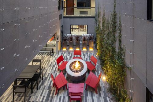 an overhead view of a patio with tables and chairs at Infinity Hotel San Francisco, Tapestry Collection by Hilton in San Francisco