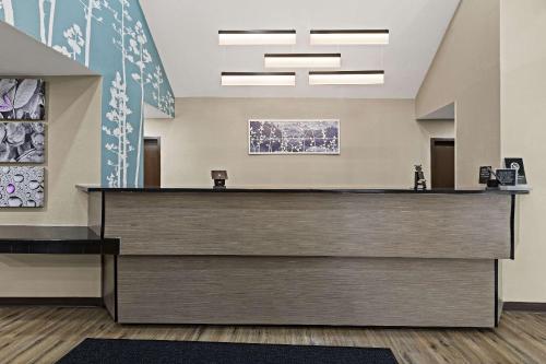a lobby with a reception desk in a building at Sleep Inn in Lithonia