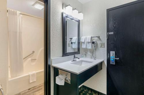 a bathroom with a sink and a mirror at Clarion Pointe in Jasper