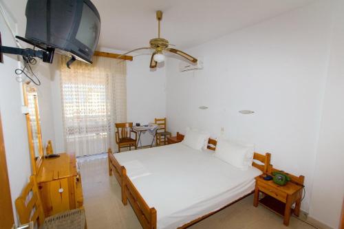 Giường trong phòng chung tại Valkaniotis Apartments