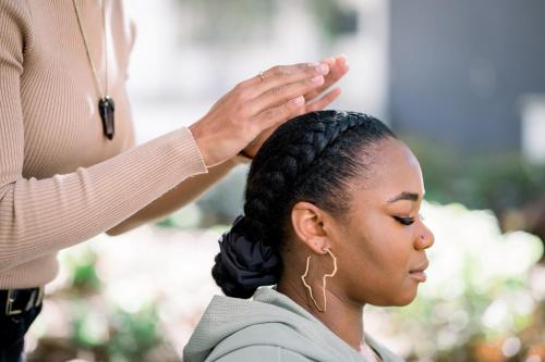a woman getting her hair styled at a salon at Ponci’s Gate to Gaia Holistic Center in Bocas del Toro