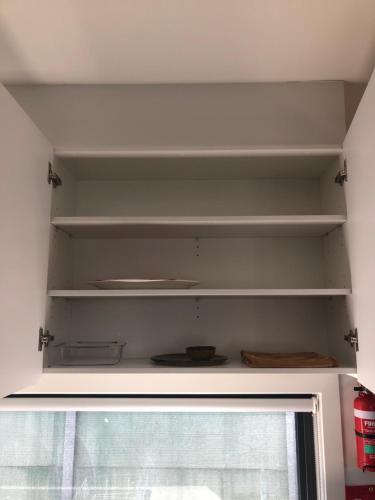 a shelf in a room with a window at 2Bedroom Tranquil Townhouse CLOSE TO CITY & AIRPORT in Melbourne