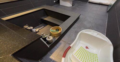 a bathroom with a sink and a bath tub at Muzhe-Fascinating in Dongshan
