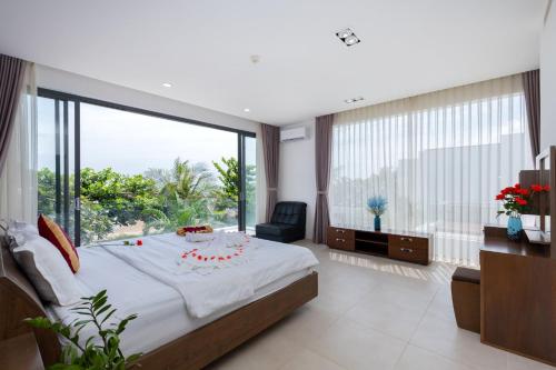 Postel nebo postele na pokoji v ubytování Sát Biển D6