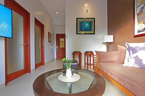 a living room with a couch and a table at Aloha Boracay Hotel in Boracay
