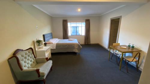 a hotel room with a bed and a table at Templo de la Luna in Cusco