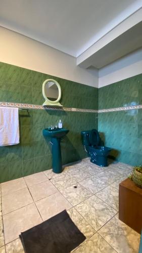 a bathroom with a blue sink and a toilet at Templo de la Luna in Cusco