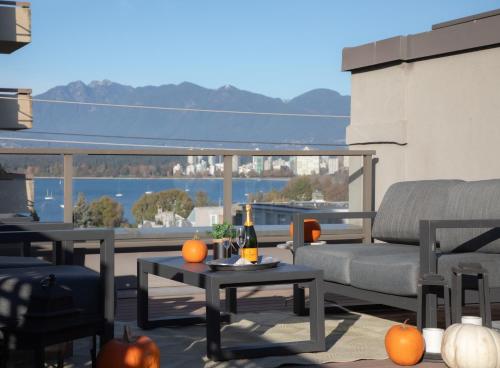 a patio with a couch and a table with pumpkins at Historic Townhouse in Kitsilano in Vancouver