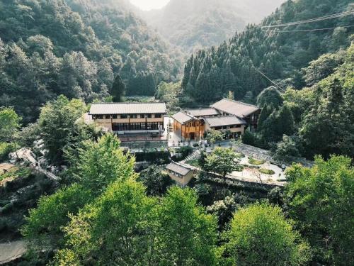 an aerial view of a building in a mountain at Wudang Mountain Manju Manor in Wudangshan