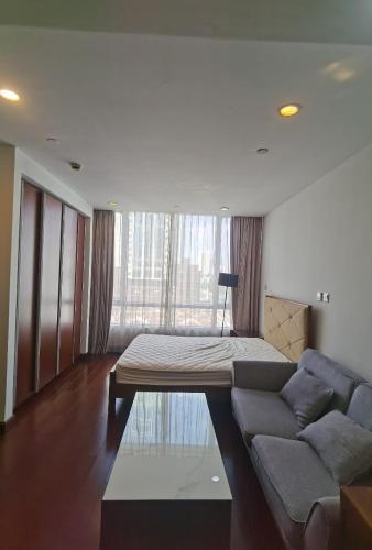 a living room with a couch and a bed at River House Near The Peoples Square And The Bund in Shanghai