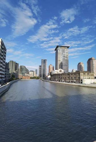 a view of a river in a city with buildings at River House Near The Peoples Square And The Bund in Shanghai